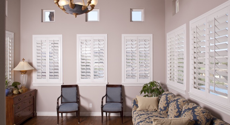 Chic sunroom with interior shutters