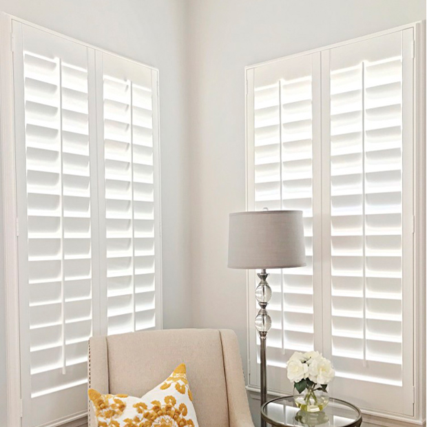 White casement window in corner of living room