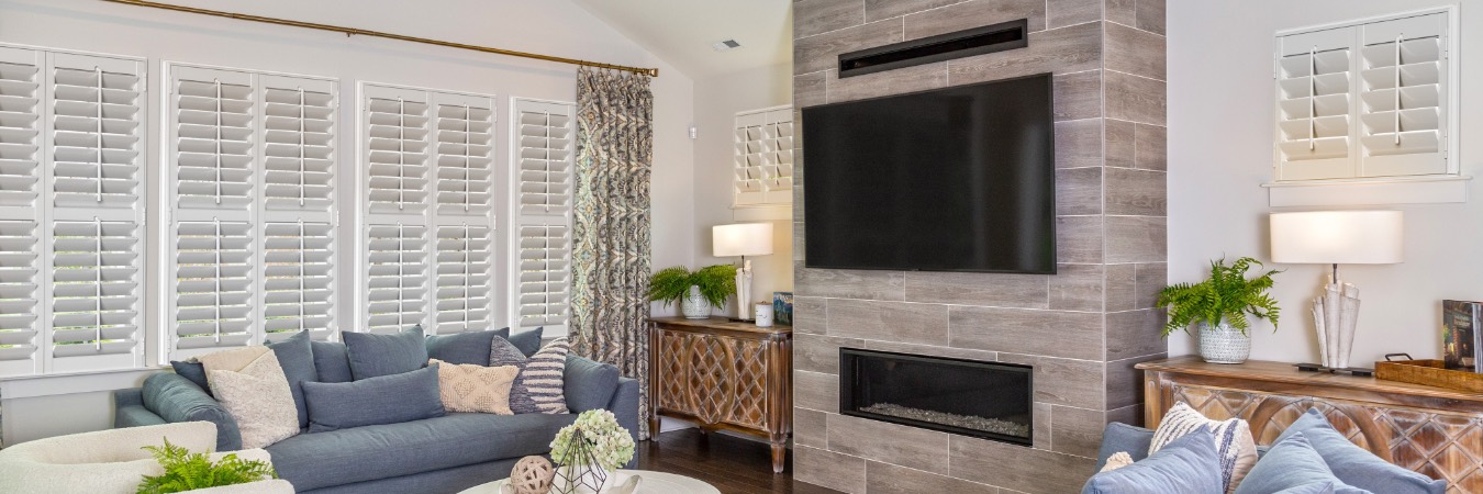 Interior shutters in Winston-Salem living room with fireplace