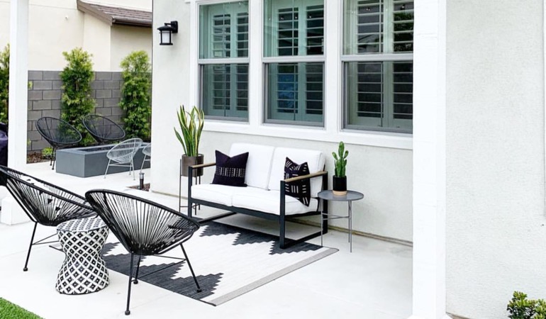 Spending a little time mulching and weeding can provide you with a backyard oasis. Backyard with plantation shutters