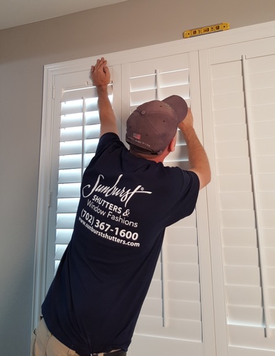 Shutter installation in Charlotte bedroom.