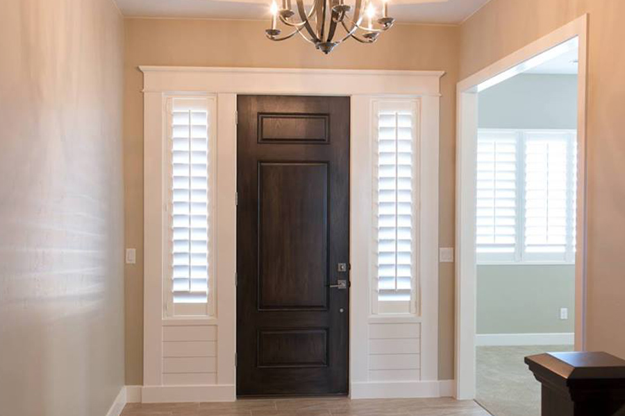 White shutters on sidelights.
