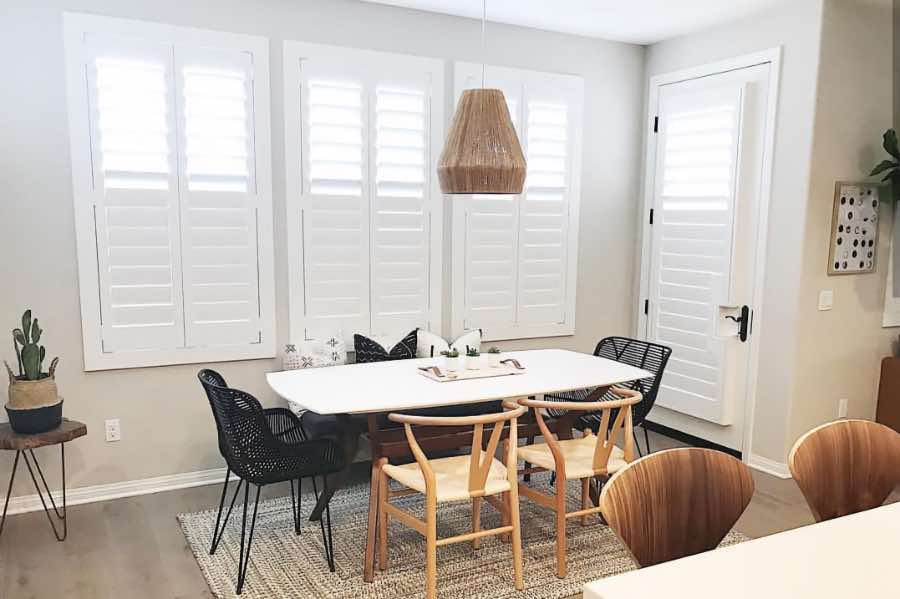 Use Polywood shutters to control natural light levels in your Charlotte dining room. Polywood shutters with top louvers tilted open in a dining room