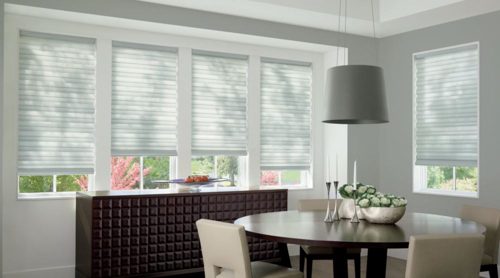 Custom cordless roller shades have a clean look and are appropriate for any room. Cordless motorized shades in a Charlotte dining room