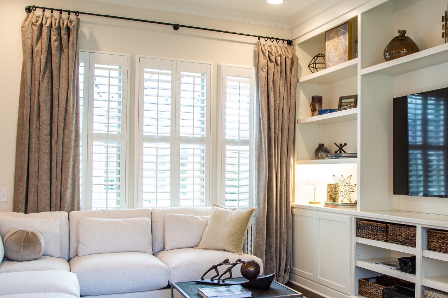 Install sun-resistant Polywood shutters in Charlotte. Shutters in a living room