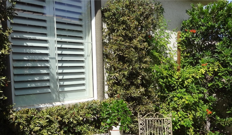 Adding flowers and greenery can really give your outside areas some pop.