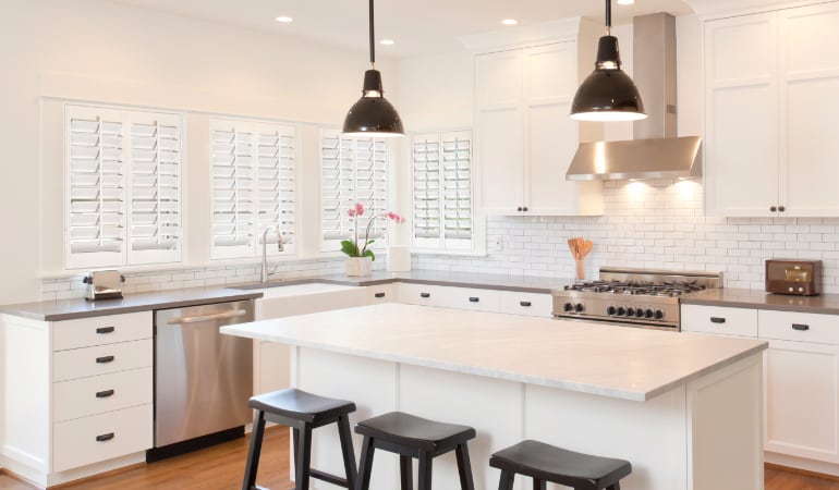 Plantation shutters in a bright Charlotte kitchen.