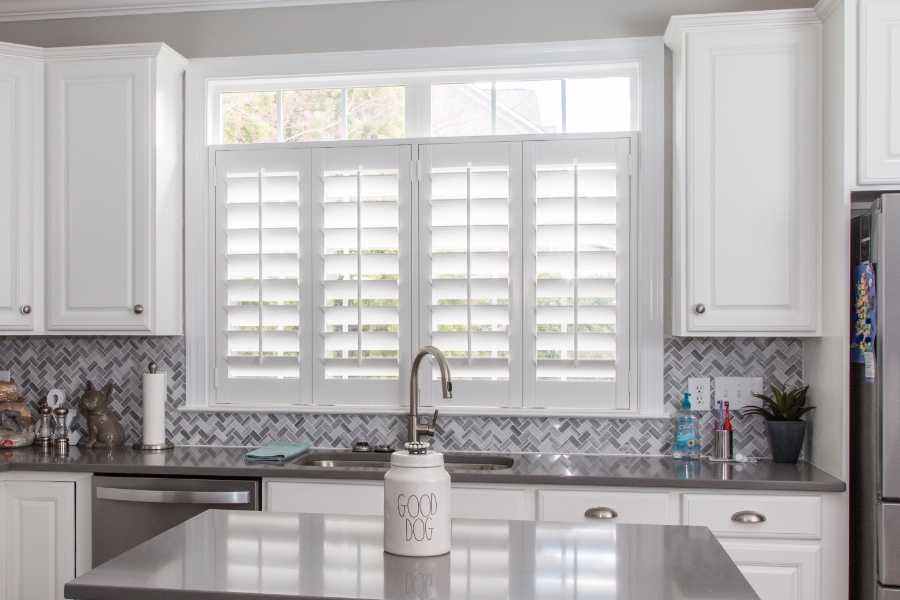 Classic Polywood interior shutters in Charlotte are moisture-resistant. White Polywood shutters above a kitchen sink