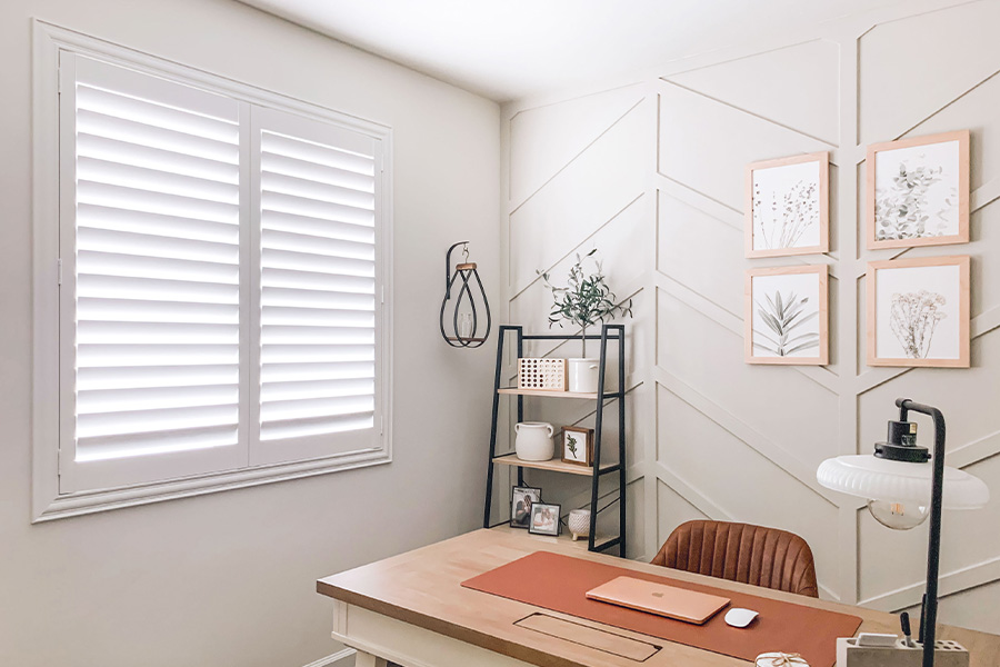 Polywood shutters give you maximum control over natural light in your Charlotte home. Photo Credit: @OurLakepoint Farmhouse White and off-white farmhouse style office with natural light from polywood shutters.