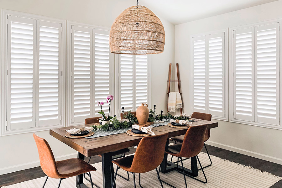 Classic white Polywood shutters look stunning with any decor style. Photo credit: @AudreyCrispInteriors White Polywood shutters in a large dining area.
