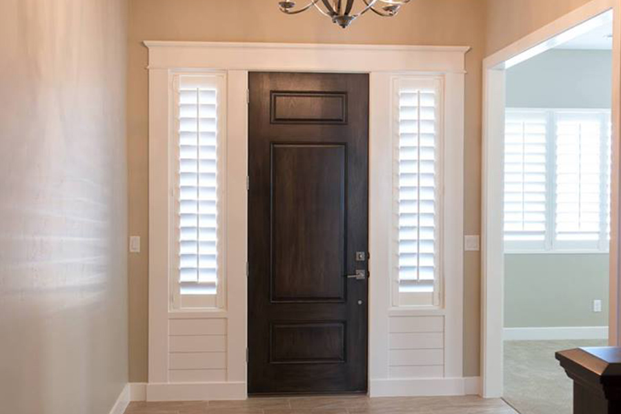 Polywood shutters provide privacy to your sidelight windows. Sidelights with white polywood shutters in a foyer.